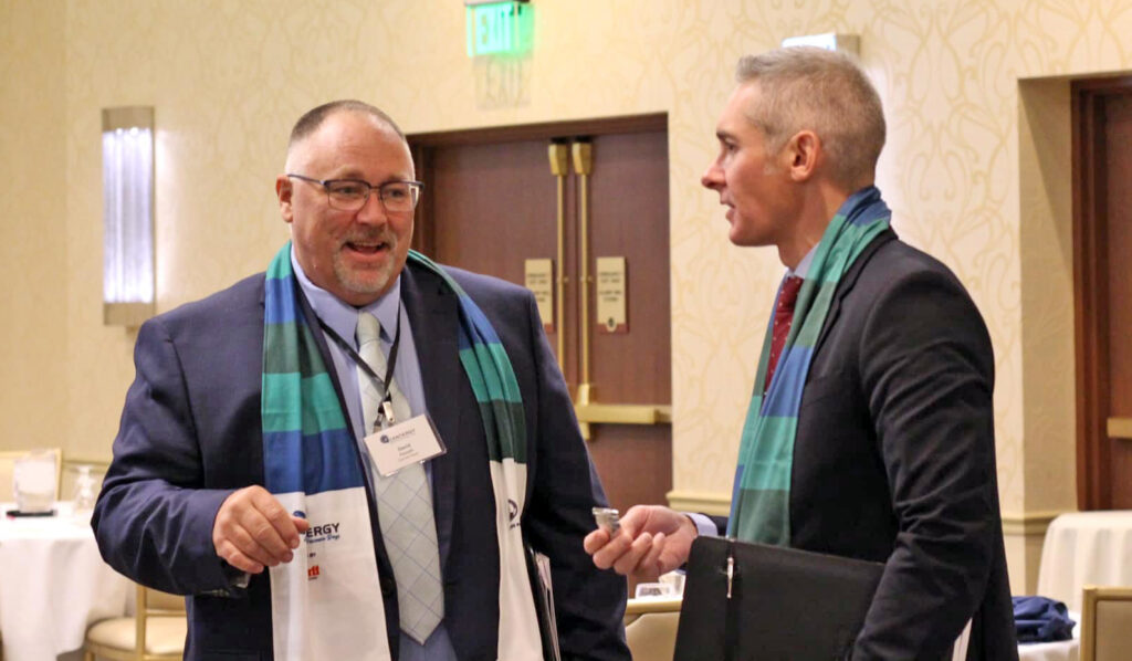 Dan Persica, right, and Dave Faucett, left, represented Domtar’s Rothschild Mill during Central Wisconsin Days in Madison.