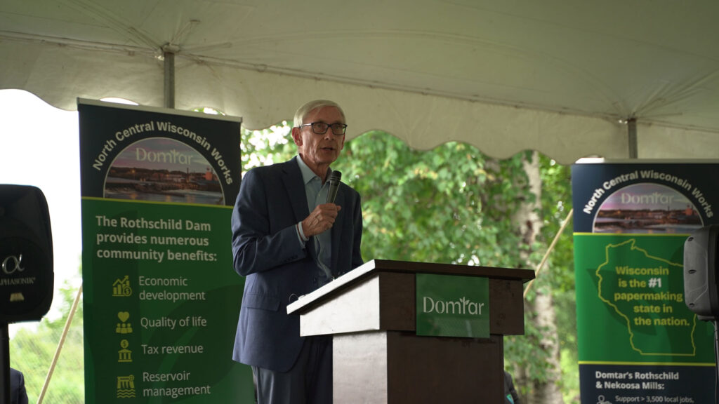 Wisconsin Gov. Tony Evers addresses the audience at the groundbreaking ceremony for the Rothschild Dam modernization project.