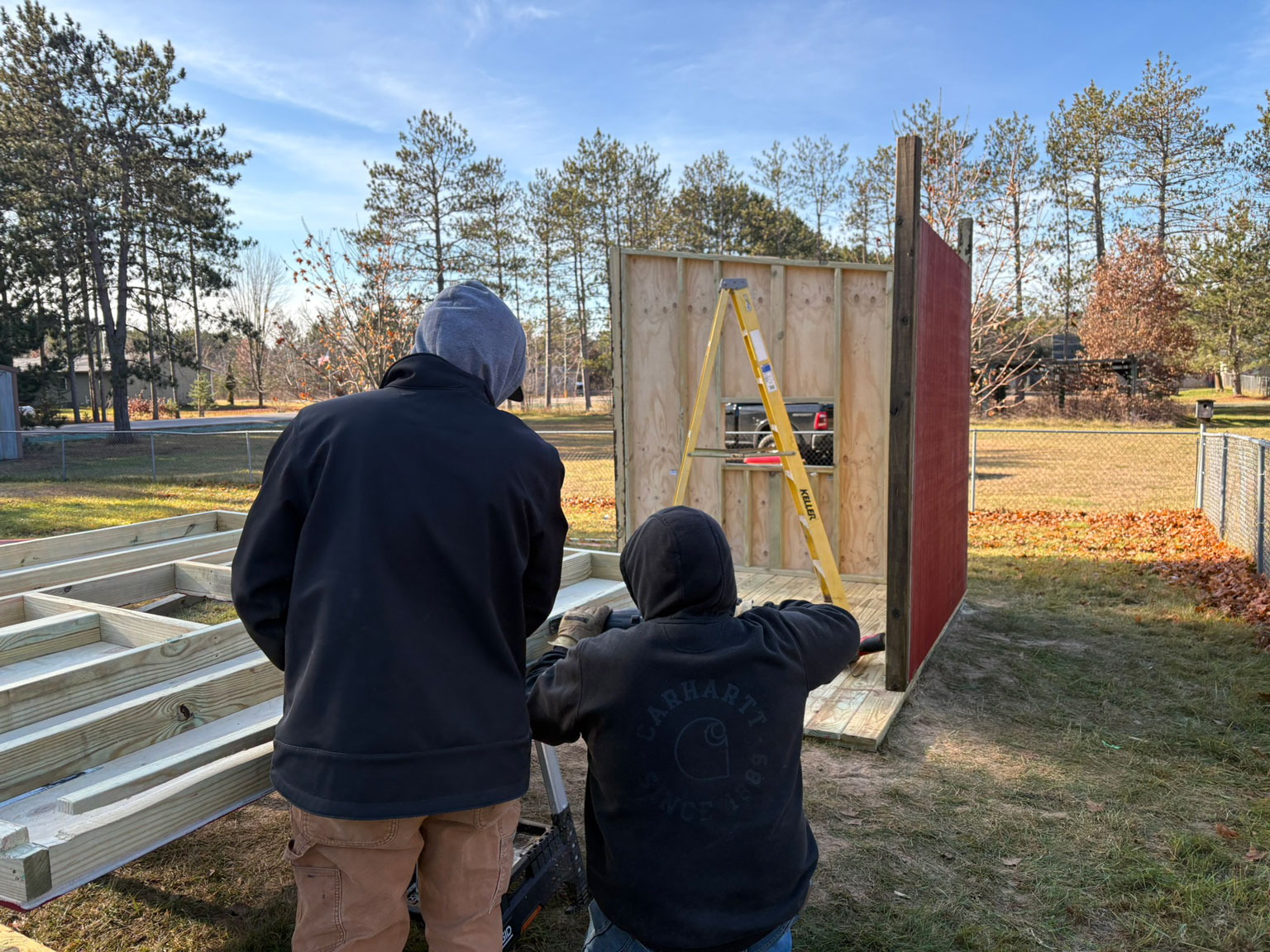 Members of Domtar’s Nekoosa Mill assemble the frame of a new outdoor playhouse for students at Chahk Ha Chee Head Start.