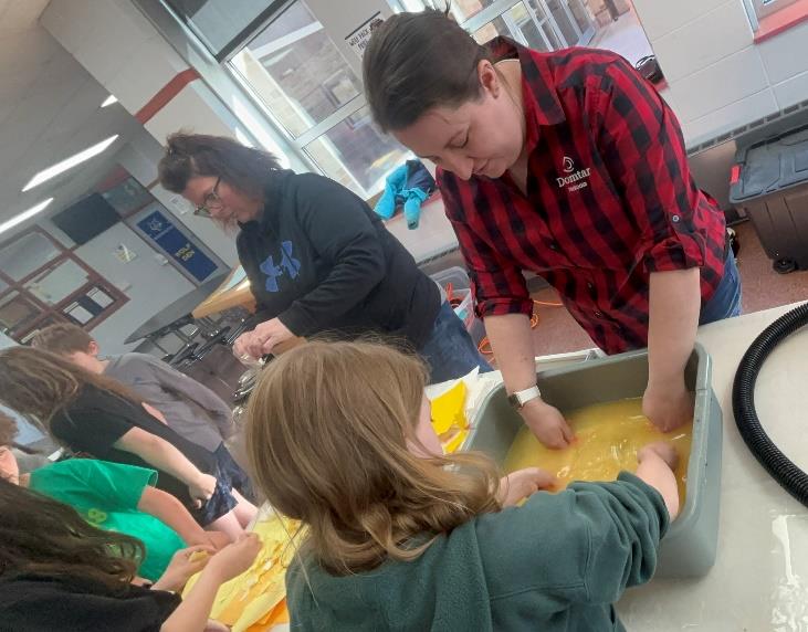 Students participate in a hands-on papermaking activity led by Domtar Nekoosa Mill employees at Humke Elementary