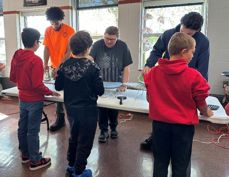 Domtar Nekoosa Mill employees demonstrate the papermaking process to students during a classroom visit at Humke Elementary