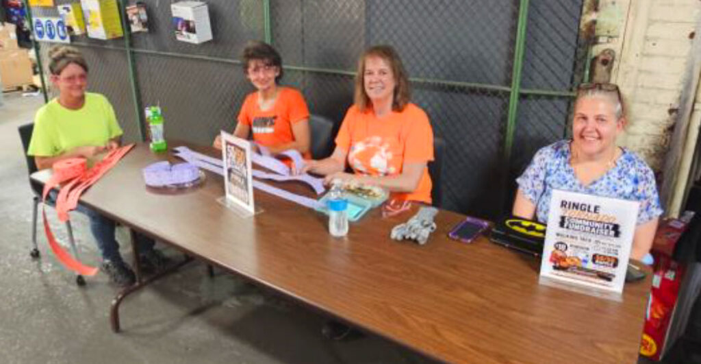 Volunteers assist at the Ringle Tornado Relief fundraiser hosted by Domtar’s Rothschild Mill.