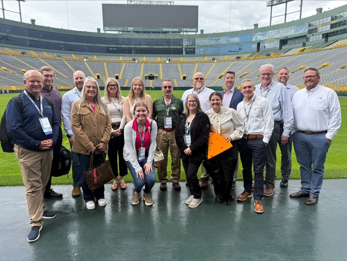Wisconsin Paper Council Annual Meeting attendees on the field at Lambeau Field.