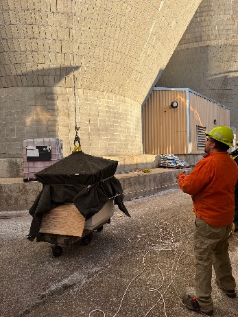 Crews hoisting the peregrine falcon nesting box into place at Domtar's Nekoosa Mill, February 2026
