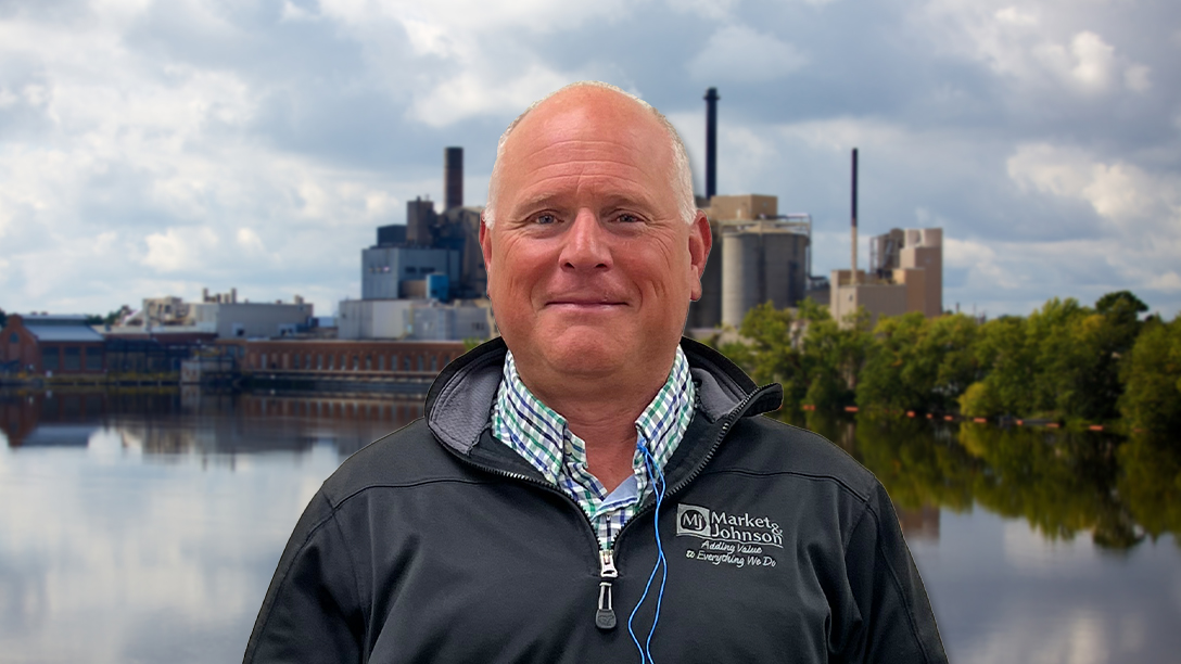 Craig Helgeson, general manager of Domtar’s Nekoosa Mill, standing in front of the mill along the Wisconsin River